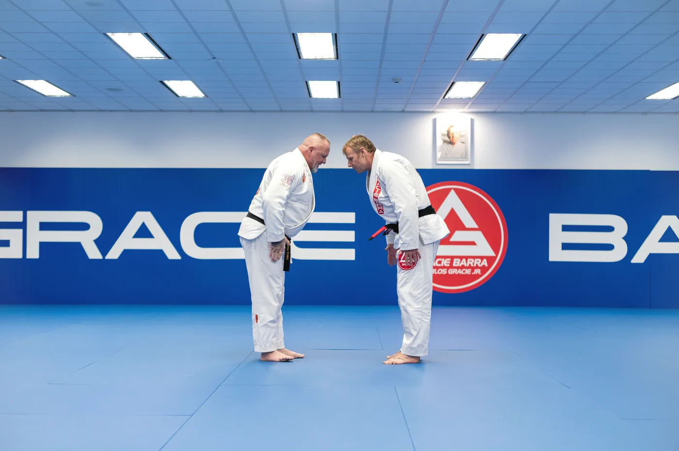 Two adult students bowing before a Jiu-Jitsu session at Gracie Barra Sutton Parade